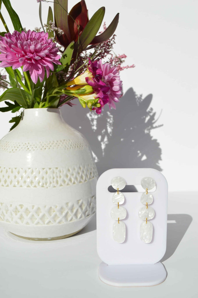 Juno earrings - pearl-Hagen + Co-A contemporary earring with drops of organic shapes in a beautiful pearl coloured marble acrylic. So sleek and timeless. *Materials: Acrylic*Nickel Free earring posts *Light weight and easy to wear. *Earring: 16mm x 65mm *Packaged in a gift box-Pash + Evolve