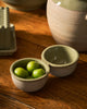 Kitchen Life Condiment Set - Peppercorn-Robert gordon-Inspired by the steady rhythm of the kitchen, this collection celebrates the beauty of daily preparation and time spent cooking. Subtle glazes and gentle leaf embellishment introduce softness and balance to everyday cooking, finished in a reactive glaze with delicate speckling. Made from stoneware Microwave & Dishwasher safe Earthy clay body with green reactive glaze 19cm | 5cm Designed in Australia-Pash + Evolve