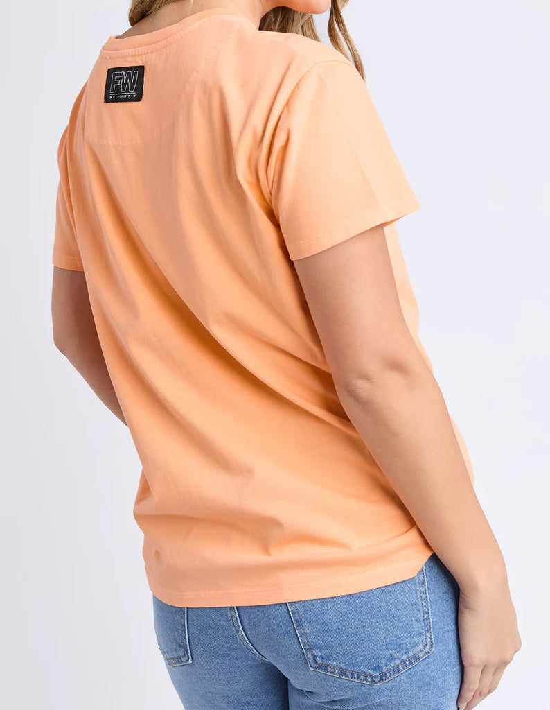 La Aths Tee - Peach-Foxwood-The LA Aths Tee brings a fun, sporty edge to your casual look. Made from soft 100% cotton, it features an exclusive Foxwood front chest print with bold lettering and a palm graphic. Designed with a round neckline and relaxed fit, it’s an easy style for everyday wear. Foxwood exclusive front chest print Round neckline Relaxed fit 100% Cotton Model is wearing a size 10-Pash + Evolve