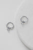 Leila earring - silver-Zafino-The Leila Earring is a delicate huggie hoop featuring a tiny crystal drop that adds a subtle touch of sparkle. Perfect for everyday wear or layering with other styles, this piece offers effortless elegance in a dainty design. Metal: Silver Rhodium Plated on BrassOverall Dimensions: 4mm x 15mm Hoop - 10mm HoopWater Resistant: Splash proof, not recommended to be worn in the ocean or pool Water resistant Hypoallergenic & Nickel Free Female Founded & Family Owned-Pash + Evolve