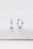 Leila earring - silver-Zafino-The Leila Earring is a delicate huggie hoop featuring a tiny crystal drop that adds a subtle touch of sparkle. Perfect for everyday wear or layering with other styles, this piece offers effortless elegance in a dainty design. Metal: Silver Rhodium Plated on BrassOverall Dimensions: 4mm x 15mm Hoop - 10mm HoopWater Resistant: Splash proof, not recommended to be worn in the ocean or pool Water resistant Hypoallergenic & Nickel Free Female Founded & Family Owned-Pash + Evolve