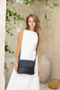 Lexci bag - Black-Baleka Leather-Defined by minimalistic elegance, the Lexci bag features a sleek foldover silhouette with thoughtful details. A secure zip closure, discreet back zip pocket and two sophisticated compartments - including a front section with an internal zip and pockets for seamless organisation. Fully lined and designed for versatility, the adjustable strap lets you wear it crossbody or over the shoulder with effortless ease - Lexci is your everyday essential! A versatile and minimalistic b