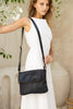 Lexci bag - Black-Baleka Leather-Defined by minimalistic elegance, the Lexci bag features a sleek foldover silhouette with thoughtful details. A secure zip closure, discreet back zip pocket and two sophisticated compartments - including a front section with an internal zip and pockets for seamless organisation. Fully lined and designed for versatility, the adjustable strap lets you wear it crossbody or over the shoulder with effortless ease - Lexci is your everyday essential! A versatile and minimalistic b