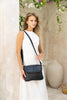 Lexci bag - Black-Baleka Leather-Defined by minimalistic elegance, the Lexci bag features a sleek foldover silhouette with thoughtful details. A secure zip closure, discreet back zip pocket and two sophisticated compartments - including a front section with an internal zip and pockets for seamless organisation. Fully lined and designed for versatility, the adjustable strap lets you wear it crossbody or over the shoulder with effortless ease - Lexci is your everyday essential! A versatile and minimalistic b