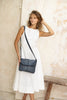 Lexci bag - Navy Blue-Baleka Leather-Defined by minimalistic elegance, the Lexci bag features a sleek foldover silhouette with thoughtful details. A secure zip closure, discreet back zip pocket and two sophisticated compartments - including a front section with an internal zip and pockets for seamless organisation. Fully lined and designed for versatility, the adjustable strap lets you wear it crossbody or over the shoulder with effortless ease - Lexci is your everyday essential! A versatile and minimalist