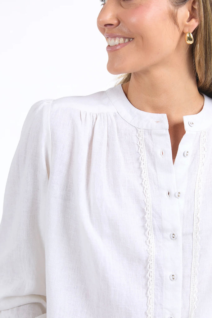 Lucille Blouse - Marshmallow-Elm-Look pretty as a picture in the new Lucille Blouse. This long sleeve linen blend shirt features a pretty front placket, button cuffs and around collar making it easy to layer. Long Sleeve Button through Linen blend Linen Viscose-Pash + Evolve