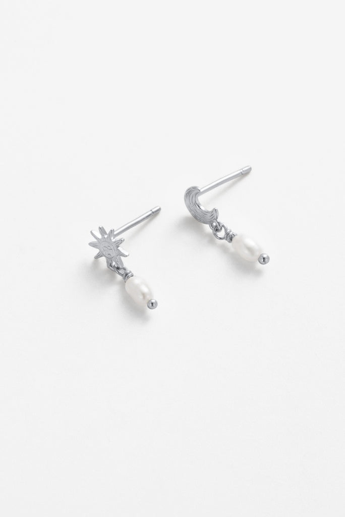 Luna pearl drop - silver-Zarla-A playful drop earring featuring mismatched sun and moon details, finished with a soft pearl. Light-catching and expressive, it brings a cool, luminous feel with a subtle celestial edge. Effortless, feminine, and designed to stand out. *Rhodium Plated Solid Brass Base *Water proof: Can be worn in the ocean or pool-Pash + Evolve