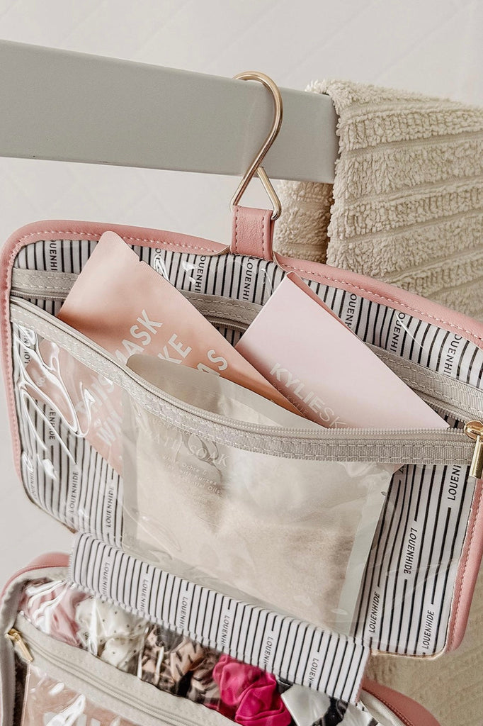 Maggie Cosmetic Case - Pale Pink-Louenhide-The Louenhide Maggie Pale Pink Cosmetic case is a beautiful quilted large toiletries bag. Designed to be functional and spacious with three clear zipped compartments to store your makeup, skincare, and toiletries all in one. This hanging cosmetic bag is designed with a hook to easily use while travelling. Take with you on weekend adventures or around the world! Internal Features 2 Zip Compartments, Hanging Hook with Zip Compartment Internal Lining Polyester Recycle