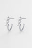 Mara hoop - Silver-Zafino-The Mara Hoop is a refined statement hoop designed to elevate your everyday. Featuring a sleek curved silhouette accented with delicate crystal detailing, these silver hoop earrings bring a clean, polished finish to your jewellery rotation. Perfect for effortless styling, they can be worn alone or layered with other earrings for a curated stack. Metal: Silver Plated on Brass baseDimensions: 20mm outer diameter, 13mm inner diameter + 4.5mm widthWaterproof: Designed for daily wear, 