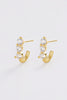 Mara huggie - gold-Zafino-The Mara Huggie Earrings are a gold crystal huggie hoop designed to elevate your everyday jewellery stack. Featuring a sleek curved silhouette set with three high-shine crystals, these gold huggie earrings add just the right amount of sparkle to any look. Perfect for stacking or wearing solo, they bring a refined, polished finish to both everyday wear and occasion styling. Metal: 18K Gold plated on brass baseDimensions: 10.5mm outer diameter, 5mm inner diameter + 3.8mm widthWaterp