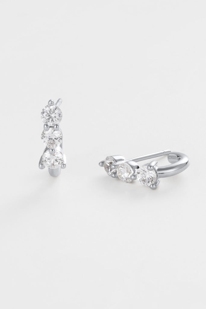 Mara huggie - silver-Zafino-The Mara Huggie in silver is a clean, polished essential with a delicate crystal accent. Three round-cut stones sit along the curved silhouette, creating a subtle shimmer against the sleek finish. Designed for effortless stacking or simple everyday wear, it adds just the right amount of interest without overpowering the look. A wearable, go-to piece suited to any jewellery collection. Silver Plated Solid Brass Base 10.5mm outer diameter, 5mm inner diameter + 3.8mm width Water pr