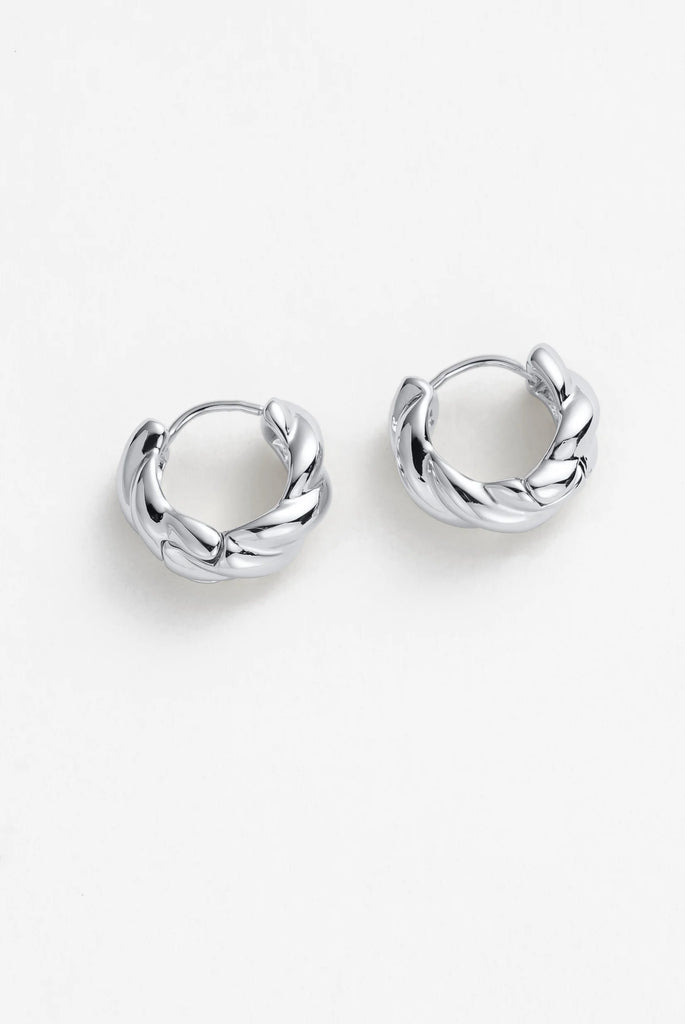 Maya Huggies - Silver-Zafino-The huggie you never take out. The Maya Huggie is designed to sit snug against the ear with a sleek, polished profile that works effortlessly with everything — from tailored blazers to off-duty, everyday styling. Minimal yet elevated, it’s the kind of piece that becomes part of your daily rotation. Perfect for stacking, wear one in each ear or pair with studs and mini hoops across multiple piercings to create a curated, layered ear look. Lightweight, secure, and made for all-day