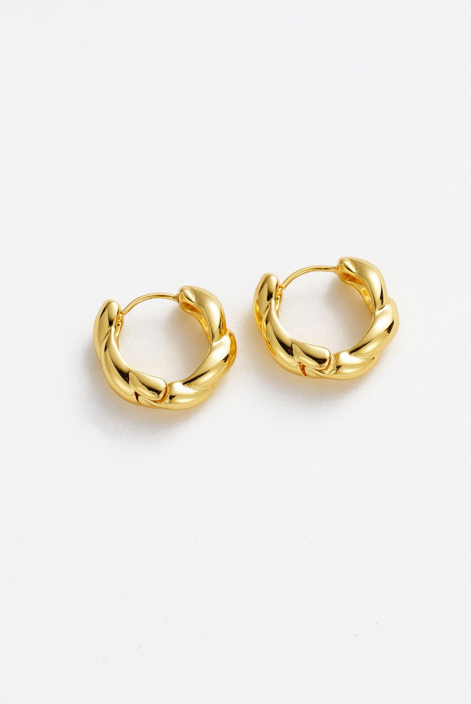 Maya hoop - gold-Zafino-Featuring a unique twist design, these hoops offer a modern yet timeless appeal, perfect for stacking or wearing solo. Their sleek silhouette and lightweight feel make them an essential addition to your jewellery collection. Metal: 18K Gold Plated on BrassDimensions: 5mm x 17mm Waterproof-Pash + Evolve