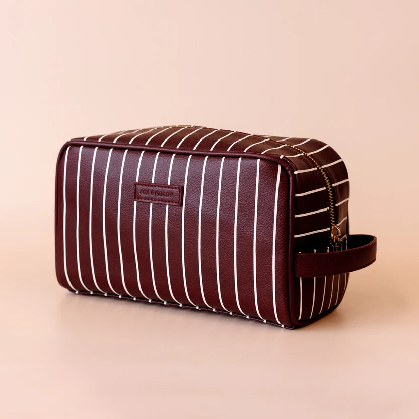 Merlot Pinstripe Wash Bag-Fox & Fallow-The bag of your dreams is here! With so many bonus features, you’ll be wondering where they’ve been all your life. Beautiful, but practical. Perfect as an everyday make up bag or for all your bathroom essentials for the next work trip or vacay. Crafted from super soft, yet durable luxury pebble vegan leather it's easy to keep clean - simply wipe down with a damp cloth. The monogrammed tan lining is designed to hide make up or spills but also makes it easy to find all 