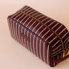 Merlot Pinstripe Wash Bag-Fox & Fallow-The bag of your dreams is here! With so many bonus features, you’ll be wondering where they’ve been all your life. Beautiful, but practical. Perfect as an everyday make up bag or for all your bathroom essentials for the next work trip or vacay. Crafted from super soft, yet durable luxury pebble vegan leather it's easy to keep clean - simply wipe down with a damp cloth. The monogrammed tan lining is designed to hide make up or spills but also makes it easy to find all 