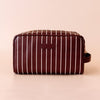 Merlot Pinstripe Wash Bag-Fox & Fallow-The bag of your dreams is here! With so many bonus features, you’ll be wondering where they’ve been all your life. Beautiful, but practical. Perfect as an everyday make up bag or for all your bathroom essentials for the next work trip or vacay. Crafted from super soft, yet durable luxury pebble vegan leather it's easy to keep clean - simply wipe down with a damp cloth. The monogrammed tan lining is designed to hide make up or spills but also makes it easy to find all 