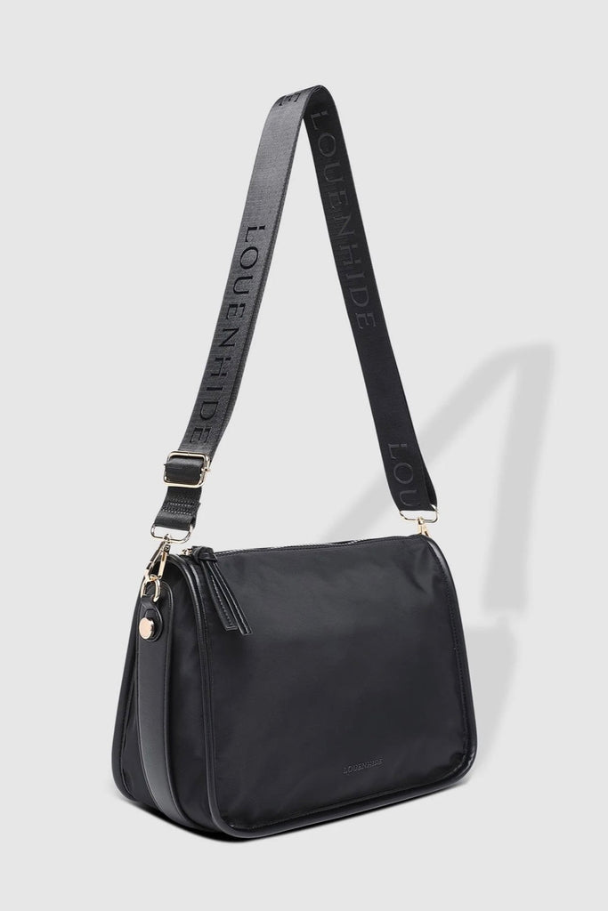 Milan Nylon Crossbody Bag - Black-Louenhide-The Louenhide Milan Black Nylon Crossbody Bag effortlessly combines an elevated minimal aesthetic with everyday functionality. This stylish, convertible crossbody bag features an adjustable and detachable sateen guitar strap and a comfortable vegan leather shoulder strap, which tucks securely under the bag with a press stud closure when not in use. Lightweight and durable, the nylon material compliments an urban, street style aesthetic while remaining reliable for