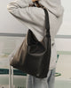 Miley Convertible Backpack - Black-Louenhide-The Miley Black Convertible Backpack is designed for days that shift between plans, places, and moods. A modern essential, she redefines the everyday with a sense of ease and understated polish. Miley Black adapts as your itinerary unfolds, worn on the shoulder or styled as a backpack with her convertible straps, making her the perfect travel backpack for women on the move. Her softly structured silhouette balances polish with ease, while the smooth vegan leathe