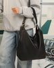 Miley Convertible Backpack - Black-Louenhide-The Miley Black Convertible Backpack is designed for days that shift between plans, places, and moods. A modern essential, she redefines the everyday with a sense of ease and understated polish. Miley Black adapts as your itinerary unfolds, worn on the shoulder or styled as a backpack with her convertible straps, making her the perfect travel backpack for women on the move. Her softly structured silhouette balances polish with ease, while the smooth vegan leathe