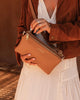Millie crossbody bag - caramel-Louenhide-In a new, improved size! The Louenhide Millie Caramel Crossbody Bag is a timeless and functional everyday bag, designed to keep you organised and stylish throughout your day. Divided into two functional compartments, this casual crossbody bag provides the perfect solution for keeping your essentials neatly organised. Finished in a smooth vegan leather exterior, this women's crossbody bag is ready to withstand daily wear and tear, ensuring it remains a reliable compan