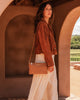 Millie crossbody bag - caramel-Louenhide-In a new, improved size! The Louenhide Millie Caramel Crossbody Bag is a timeless and functional everyday bag, designed to keep you organised and stylish throughout your day. Divided into two functional compartments, this casual crossbody bag provides the perfect solution for keeping your essentials neatly organised. Finished in a smooth vegan leather exterior, this women's crossbody bag is ready to withstand daily wear and tear, ensuring it remains a reliable compan
