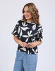 Mimosa Tee - Black Print-Elm-Redefine comfort and chic with the Mimosa Tee, made for layering or wearing solo. This piece is pure Elm: playful, polished, and practical. Exclusive Elm print Slide Splits Drop shoulder Organic Cotton Jersey Model is 171cm and wears Size 10-Pash + Evolve