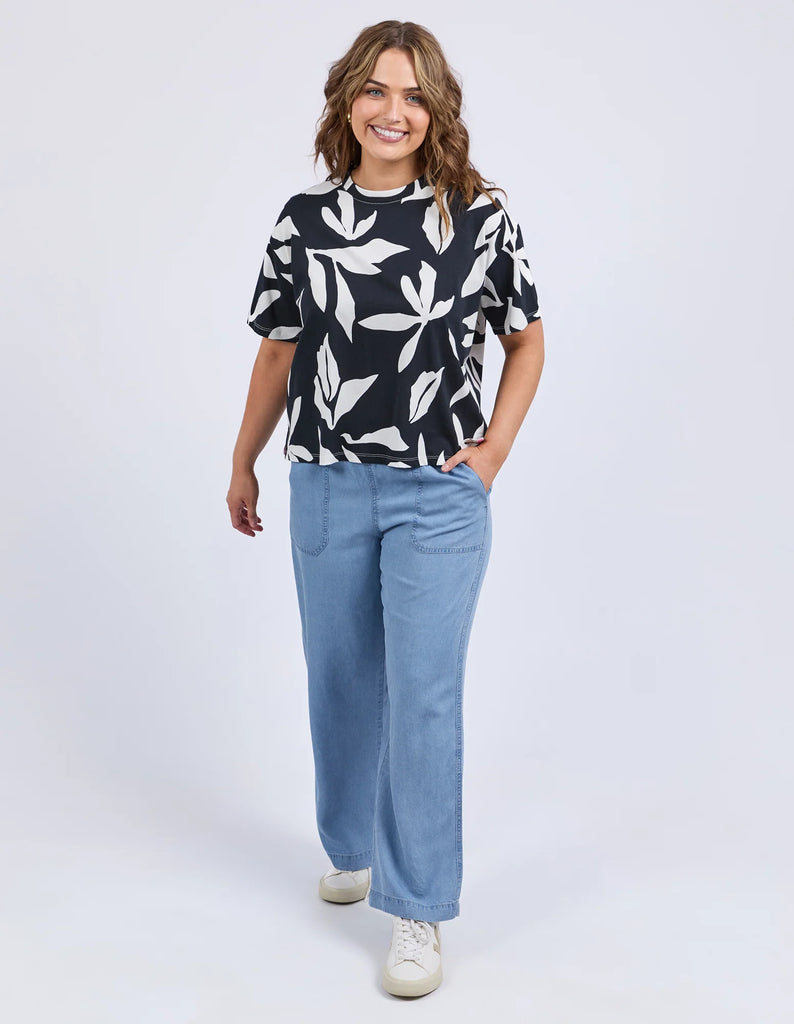 Mimosa Tee - Black Print-Elm-Redefine comfort and chic with the Mimosa Tee, made for layering or wearing solo. This piece is pure Elm: playful, polished, and practical. Exclusive Elm print Slide Splits Drop shoulder Organic Cotton Jersey Model is 171cm and wears Size 10-Pash + Evolve