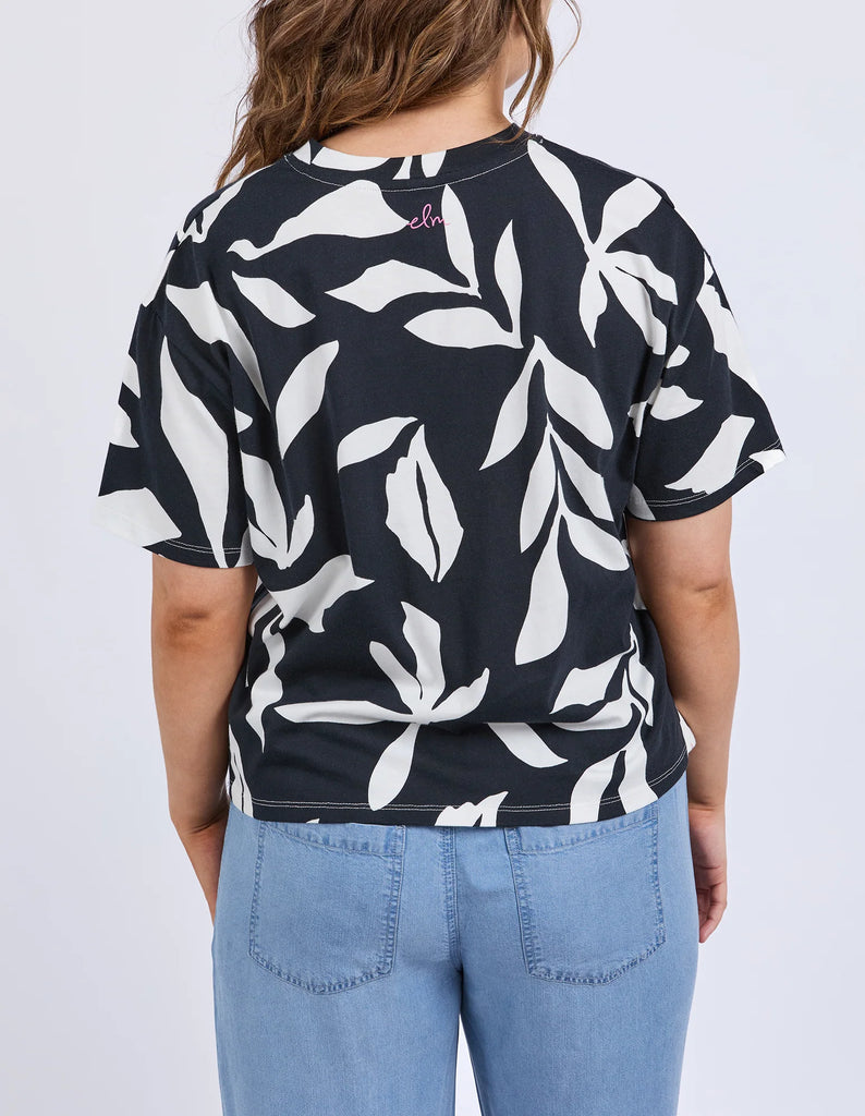 Mimosa Tee - Black Print-Elm-Redefine comfort and chic with the Mimosa Tee, made for layering or wearing solo. This piece is pure Elm: playful, polished, and practical. Exclusive Elm print Slide Splits Drop shoulder Organic Cotton Jersey Model is 171cm and wears Size 10-Pash + Evolve