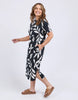 Mimosa Tee Dress - Black Print-Elm-Fresh and bold this exclusive Mimosa Print has been designed by our in-house Elm designers and complements the new Mimosa Tee Dress beautifully. The print takes the effortless comfort of a tee dress and makes it a stylish must-have. Exclusive Elm print Slide Splits Regular Tshirt dress fit Organic Cotton Jersey Model is 171cm and wears Size 10-Pash + Evolve