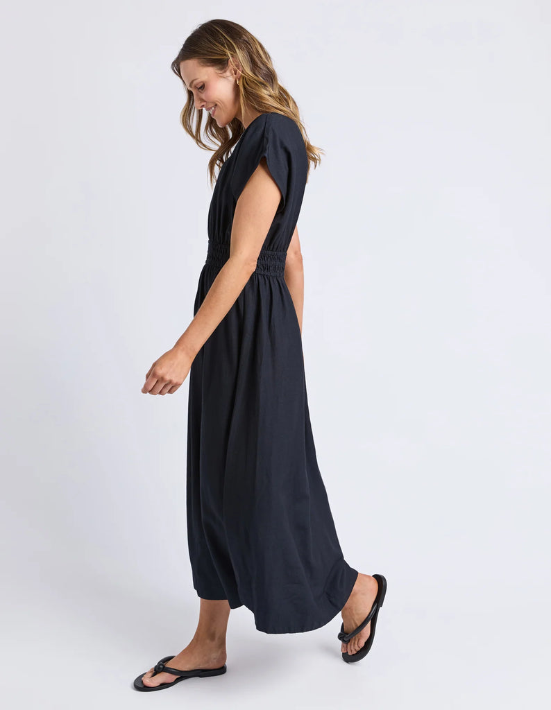 Misty Dress - Navy-Elm-The Misty Dress is crafted from a breathable linen blend, perfect for comfort and durability. Featuring an elastic waist, it offers a flattering, adaptable fit, while the midi length provides timeless elegance suitable for various occasions. Expertly designed, this dress combines practicality with refined style for a sophisticated addition to your wardrobe. Elastic waist Mid length Linen blend 30% linen 70% viscose Model is 171cm and wears Size 10-Pash + Evolve