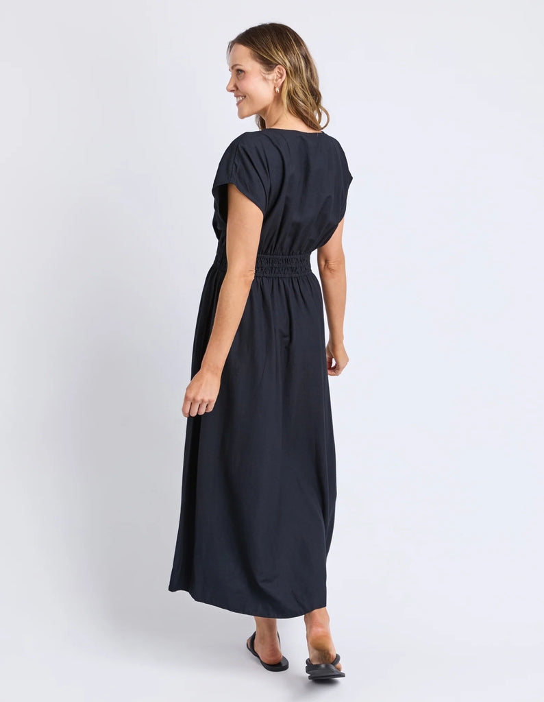 Misty Dress - Navy-Elm-The Misty Dress is crafted from a breathable linen blend, perfect for comfort and durability. Featuring an elastic waist, it offers a flattering, adaptable fit, while the midi length provides timeless elegance suitable for various occasions. Expertly designed, this dress combines practicality with refined style for a sophisticated addition to your wardrobe. Elastic waist Mid length Linen blend 30% linen 70% viscose Model is 171cm and wears Size 10-Pash + Evolve