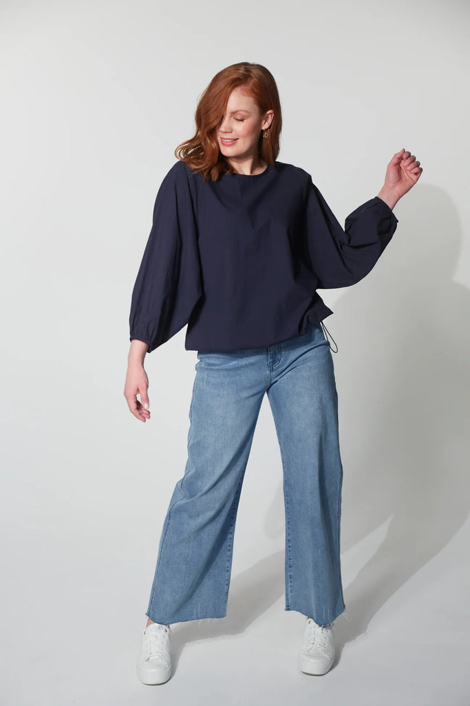 Montrose Top - Midnight-HAVEN-Meet the Montrose Top, a testament to versatility. Perfect for a polished office look with trousers or a chic, casual ensemble paired with your favourite denim. Crafted from soft and durable cotton poplin, it provides a luxurious feel. The batwing sleeves and bubble hem with an elastic toggle add bold flair, making it a stylish choice for any occasion. Round neck Batwing sleeve with elastic cuff Bubble hem with elastic toggle Easy fit 100% Cotton XS/S, S/M, M/L, L/XL-Pash + Evo