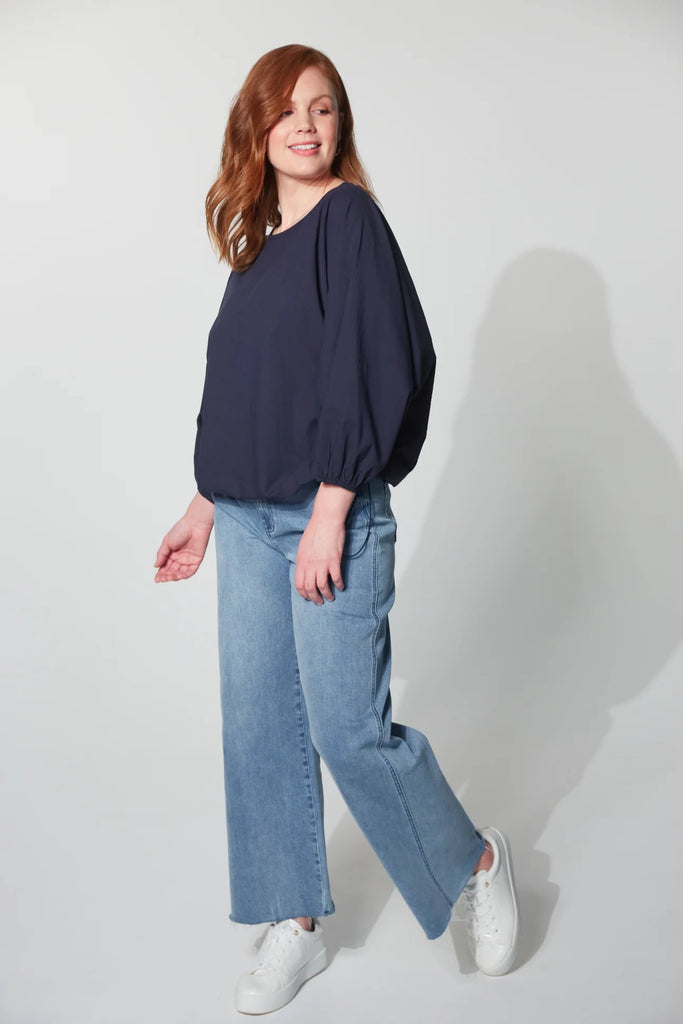 Montrose Top - Midnight-HAVEN-Meet the Montrose Top, a testament to versatility. Perfect for a polished office look with trousers or a chic, casual ensemble paired with your favourite denim. Crafted from soft and durable cotton poplin, it provides a luxurious feel. The batwing sleeves and bubble hem with an elastic toggle add bold flair, making it a stylish choice for any occasion. Round neck Batwing sleeve with elastic cuff Bubble hem with elastic toggle Easy fit 100% Cotton XS/S, S/M, M/L, L/XL-Pash + Evo
