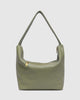 Morgan shoulder bag - sage-Louenhide-The Louenhide Morgan Sage Shoulder Bag brings a bold sense of ease to your everyday. With its slouchy, oversized silhouette and subtle studded detailing, this hobo shoulder bag makes a statement without trying too hard. Designed for the throw-and-go days, its laid-back shape pairs perfectly with lived-in denim, soft layers, and easy flowy dresses. Slung over your shoulder, the Morgan Sage Shoulder Bag delivers effortless wearability and a softly structured finish that fe