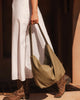 Morgan shoulder bag - sage-Louenhide-The Louenhide Morgan Sage Shoulder Bag brings a bold sense of ease to your everyday. With its slouchy, oversized silhouette and subtle studded detailing, this hobo shoulder bag makes a statement without trying too hard. Designed for the throw-and-go days, its laid-back shape pairs perfectly with lived-in denim, soft layers, and easy flowy dresses. Slung over your shoulder, the Morgan Sage Shoulder Bag delivers effortless wearability and a softly structured finish that fe
