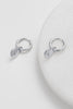 Nala hoop - Silver-Zafino-A stunning and addition to your jewellery collection. These earrings feature a beautiful disk charm with a sparkling crystal star in the centre that adds a touch of magic to your look. Made with high-quality materials and attention to detail, the Nala Earring is both durable and captivating. With their comfortable fit and easy-to-wear closure, they are perfect for everyday wear or special occasions. Metal: 18K Gold Plated on BrassDimensions: 10mm HoopWater Resistant: Splash proof,