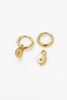 Nala hoop - gold-Zafino-A stunning and addition to your jewellery collection. These earrings feature a beautiful disk charm with a sparkling crystal star in the centre that adds a touch of magic to your look. Made with high-quality materials and attention to detail, the Nala Earring is both durable and captivating. With their comfortable fit and easy-to-wear closure, they are perfect for everyday wear or special occasions. Metal: 18K Gold Plated on BrassDimensions: 10mm HoopWater Resistant: Splash proof, n