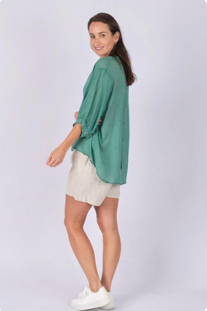 Nikola shirt - Apple green-Pash + Evolve-Nikola is always on Demand, in fact you will want to own her in every colour. This top is super easy to wear, and the most flattering fit on. Easily dress her up or down. * Button up front & back * Short sleeves * hi-low hemline * 100% Linen-Pash + Evolve