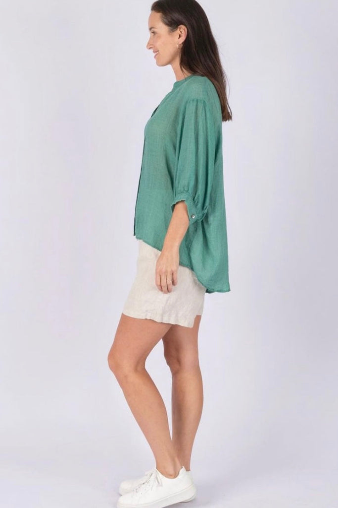 Nikola shirt - Apple green-Pash + Evolve-Nikola is always on Demand, in fact you will want to own her in every colour. This top is super easy to wear, and the most flattering fit on. Easily dress her up or down. * Button up front & back * Short sleeves * hi-low hemline * 100% Linen-Pash + Evolve