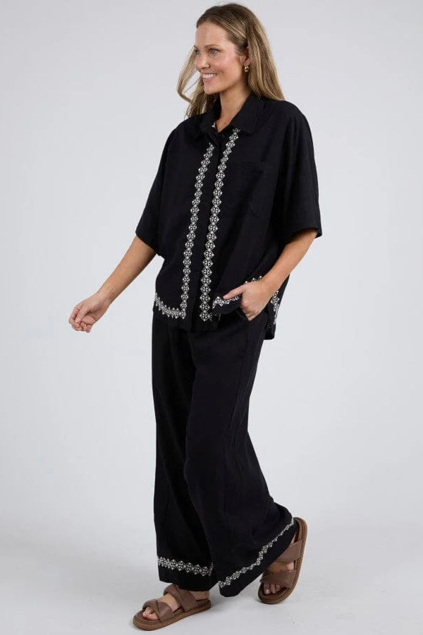 Nina embroidered shirt - black-Elm-The Nina shirt is made in a soft and flattering linen viscose blend and hang beautifully on the body. Featuring a pretty embroidery on the front placket and hemline. Pair the Nina shirt with our Nina pant for a super cute matching set! *Oversize fit *Embroidery on front *Pair with Nina pant for a matching set *55% Linen, 45% Viscose-Pash + Evolve