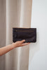 Noa wallet - chocolate-Baleka Leather-Sleek, functional, and effortlessly modern — the Noa Wallet is designed to keep your essentials beautifully organized. It features a magnetic closure for a smooth, secure snap and a back zip pocket for quick-access items. Inside, you’ll find a thoughtfully designed layout with an internal zip compartment, 2 note dividers, and 16 card slots The Noa Wallet combines practicality with a minimalist aesthetic, making it the perfect accessory for wherever your day takes you. 