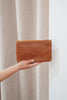 Noa wallet - vintage tan-Baleka Leather-Sleek, functional, and effortlessly modern — the Noa Wallet is designed to keep your essentials beautifully organized. It features a magnetic closure for a smooth, secure snap and a back zip pocket for quick-access items. Inside, you’ll find a thoughtfully designed layout with an internal zip compartment, 2 note dividers, and 16 card slots The Noa Wallet combines practicality with a minimalist aesthetic, making it the perfect accessory for wherever your day takes you.