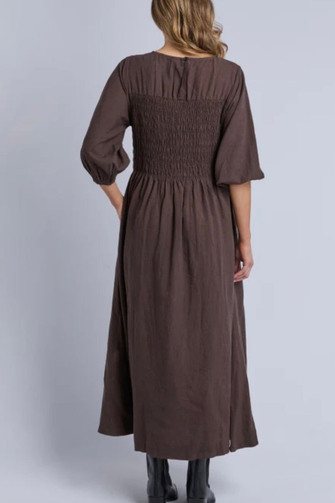 Nora shirred dress - chocolate-Elm-The Nora Shirred Dress is an easy throw-on style that balances comfort with a polished, everyday feel. Finished with trending brown colour way, elasticated bust, elastic cuff, it's designed to feel as good as it looks. Crafted from a breathable linen-viscose blend, it delivers comfortable wear and easy versatility. Style it with boots and a cosy outer layer when the weather cools, or keep it simple with sneakers for an easy one-and-done outfit. *Elasticated bust *Elastic 