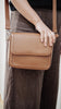 Nova bag - Camel Brown pebble-Baleka Leather-Sleek, modern & effortlessly versatile - the Nova bag is designed to elevate your everyday style. Its contemporary shape makes it the perfect accessory for any occasion, while thoughtful details ensure both form and function. The press stud button closure opens to a fully lined interior with an internal zip pocket and slip pocket to keep your essentials neatly organised. The adjustable strap allows for comfortable wear crossbody or over the shoulder - practical b
