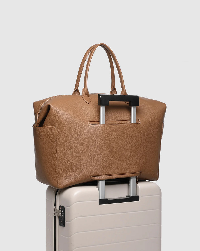 Ohio Overnight Bag - Nutmeg-Louenhide-The Ohio Nutmeg Overnight Bag is a sleek, unisex style designed for weekends away, business trips, and short getaways. A refined take on the vegan leather overnight bag, she balances functionality with effortless polish. Crafted from smooth vegan leather, her compact rectangular silhouette is perfectly sized to fit in overhead compartments, while offering a spacious interior for all your travel essentials. In a timeless tone, Ohio Nutmeg also doubles as a brown weekend