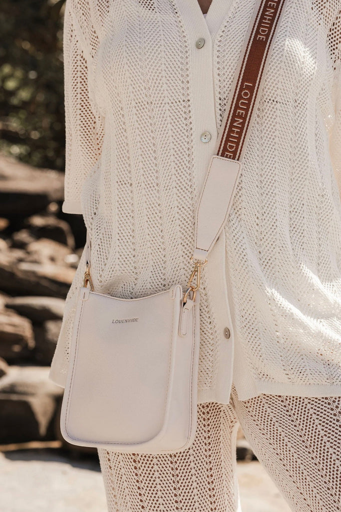 Parker Logo Phone Bag - Vanilla-Louenhide-The Louenhide Parker Vanilla Logo Phone Bag effortlessly combines an elevated aesthetic with everyday functionality. Whether you're heading to the office, running errands or meeting friends for coffee, this mini crossbody bag will be your new go-to. Parker Vanilla features an on-trend and modern silhouette, enhanced by the contrasting stitch details in three classic colourways. Elevate your style with the statement logo webbing guitar strap or keep it minimalistic w