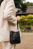 Parker Phone Crossbody Bag - Black-Louenhide-The Louenhide Parker Black Phone Crossbody Bag effortlessly combines an elevated aesthetic with everyday functionality. Whether you are heading to the office, running errands or meeting friends for coffee, this minimalistic phone bag will be your new go-to. Parker Black features an on-trend and modern portrait bag silhouette, enhanced by the contrasting stitch details in two classic colourways. Elevate your style with the adjustable webbing guitar strap or keep 