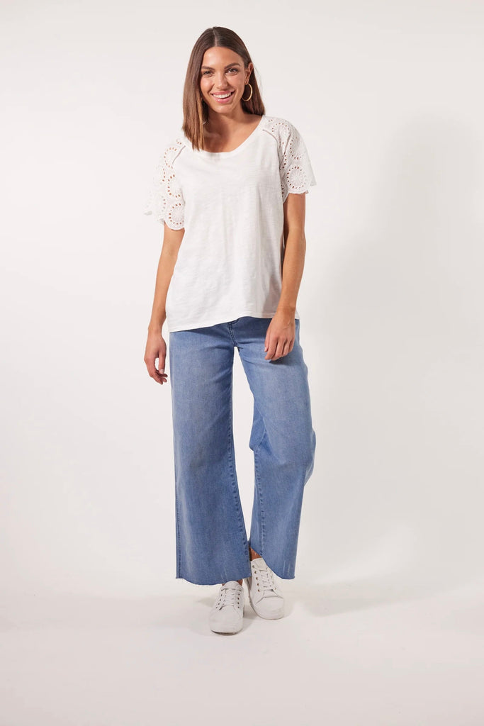 Parterre Tshirt - Lotus-Isle of Mine-Elevate your natural style with the Parterre Tshirt, crafted with lightweight cotton fabric. The broderie raglan sleeves and scalloped edge bring a touch of feminine elegance to your ensemble. Style it for a leisurely lunch with friends by pairing it with a maxi skirt, sandals, and simple accessories. FEATURES: Round neck Broderie raglan sleeves with scalloped edge Hip length fit 100% Cotton Contrast: 100% Cotton-Pash + Evolve