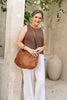Peyton bag - Vintage Tan-Baleka Leather-Effortless style meets everyday function. Peyton is softly sculpted for a relaxed modern silhouette that moves with you. Featuring a secure back zip pocket, internal zip compartments and internal slip pockets to keep your essentials organised. Wear it crossbody or over the shoulder with the adjustable strap. Fully lined with quality finished throughout, Peyton is the kind of bag you will reach for daily - Super practical & effortlessly elegant. A modern essential, de