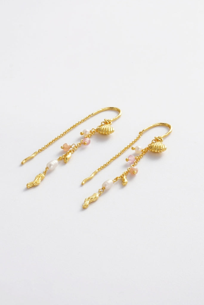 Poppy Thread Earring - Pastel-Zarla-A refined thread earring featuring soft pastel tones and delicate charms. Designed to move effortlessly with you, it catches the light with a subtle, beach-inspired elegance. Feminine, playful, and the perfect piece to elevate your everyday look. *18K Gold Plated Solid Brass *This piece is handmade and not recommended to be worn in water-Pash + Evolve